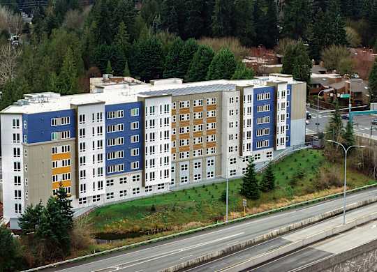 A large multi-story building with a blue and white exterior.