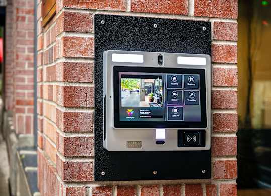 A digital display on a brick wall.
