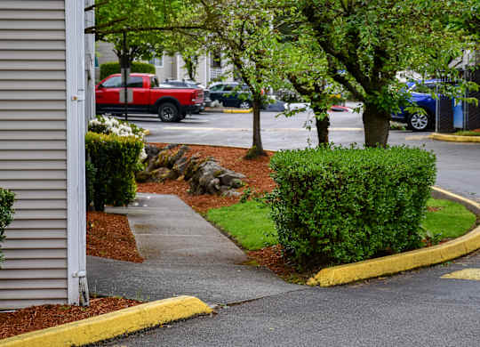A red truck is parked in a parking lot.