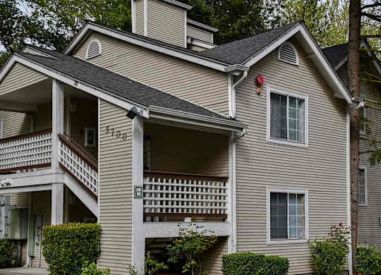 A house with a balcony and a window.