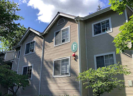 A building with a green letter F on it.