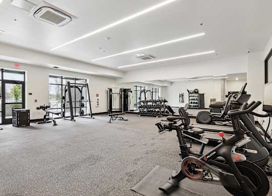A spacious gym with a variety of exercise equipment.