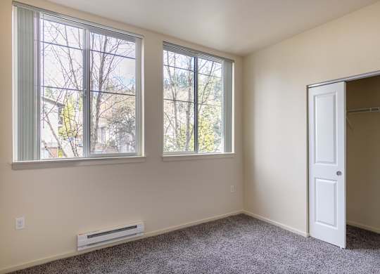 A room with a window and a door.