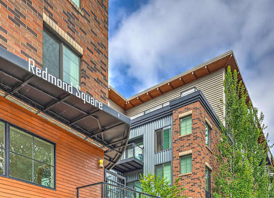 A building with a sign that says Redmond Square.