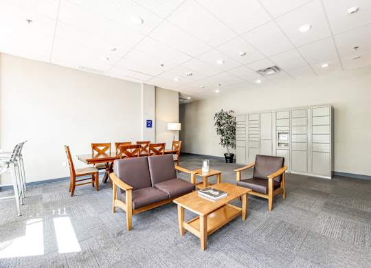 A waiting room with brown chairs and a wooden table.