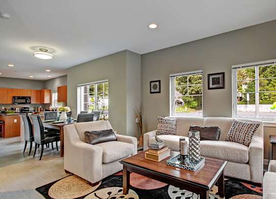 A living room with a couch, chair, and coffee table.