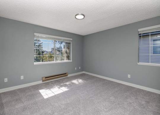 A room with a window and a bench.