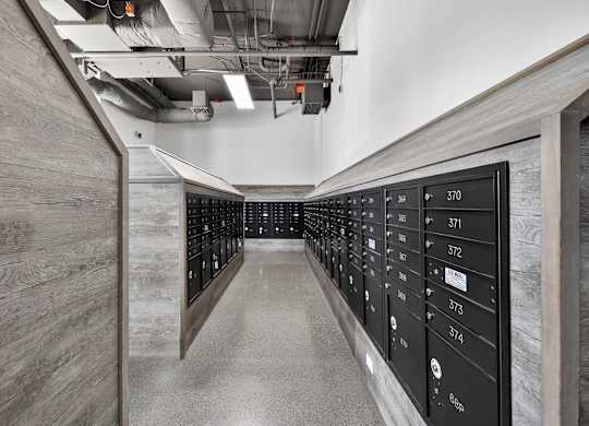 A long hallway with a series of lockers on the right side.