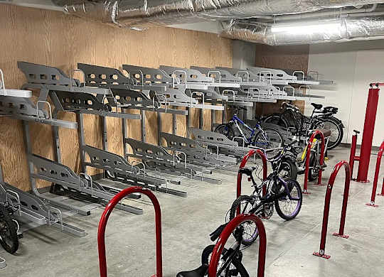 A bike is parked in a bike rack.