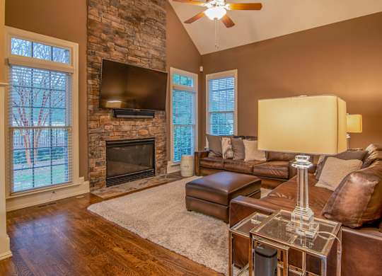 A living room with a fireplace and a couch.