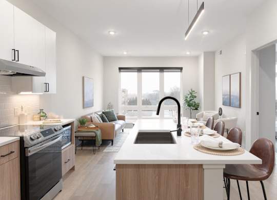 A modern kitchen with a dining area and a view of the city.