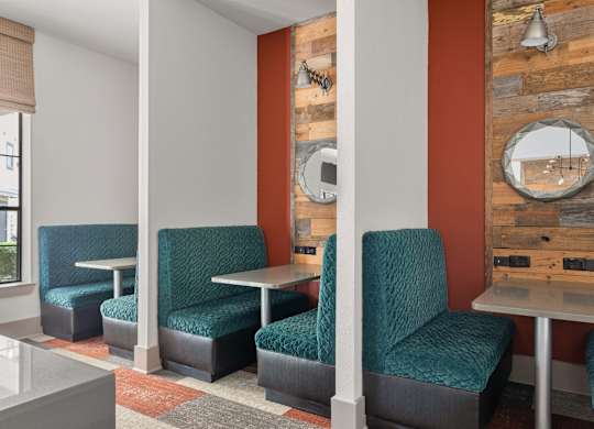 A room with a table and chairs.