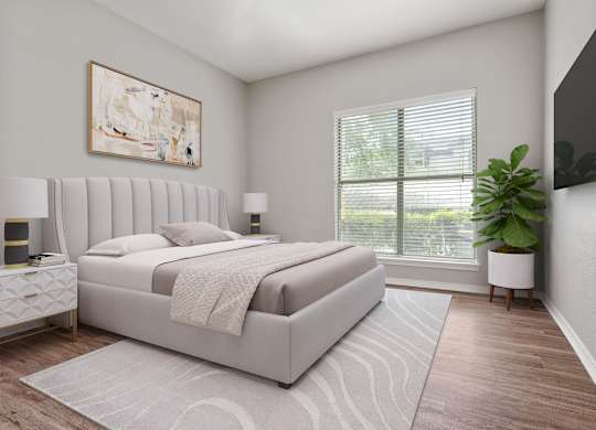 A bedroom with a large bed and a painting on the wall.