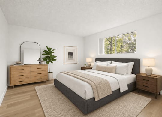A bedroom with a large bed, a dresser, and a mirror.