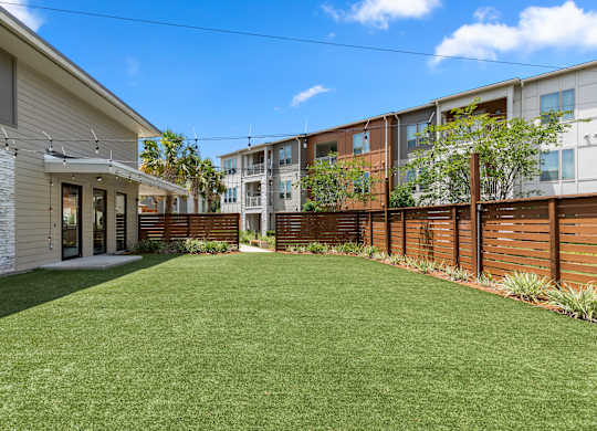 A sunny day at a residential area with a well-maintained lawn.