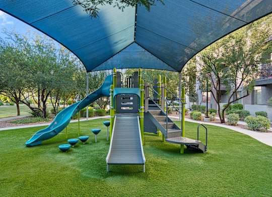 A playground with a slide and a ramp.
