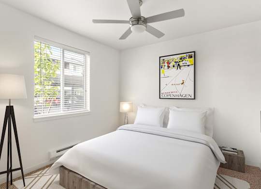 A bedroom with a large bed and a picture of Copenhagen on the wall.