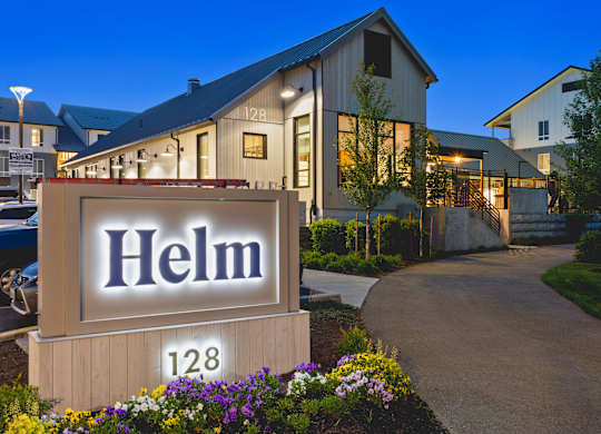 A sign that says Helm in front of a building.