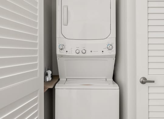 A white toilet is installed in a small white room.
