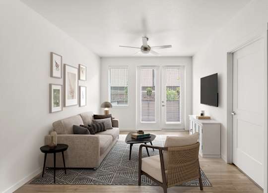 A living room with a couch, chair, and television.
