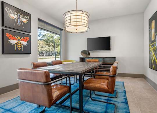 A modern dining room with a table and chairs.