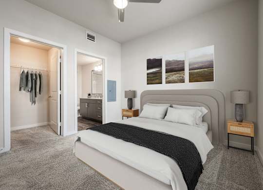 A bedroom with a large bed and a dresser with a mirror.