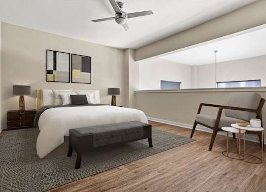 A bedroom with a bed, bench, and chair.