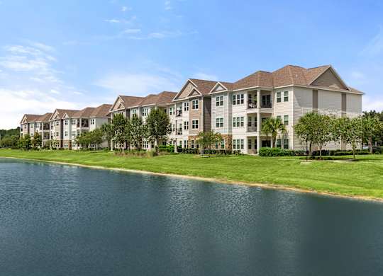 A large building with a lake in front of it.