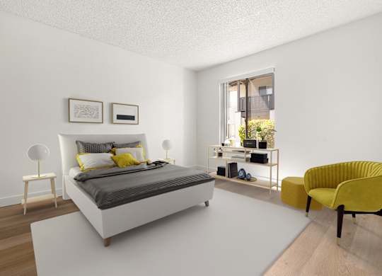 A bedroom with a white bed and yellow chair.