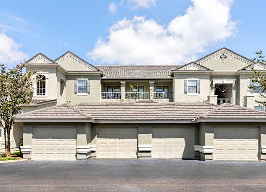 A large, two-story house with a garage.