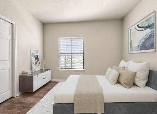 A bedroom with a bed, nightstand, and a window with blinds.
