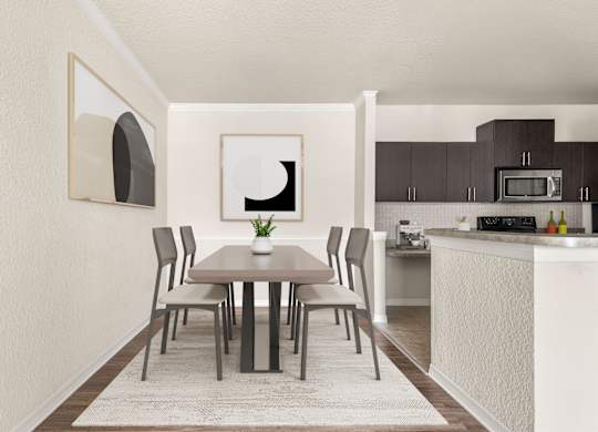 A dining table with chairs and a framed picture on the wall.