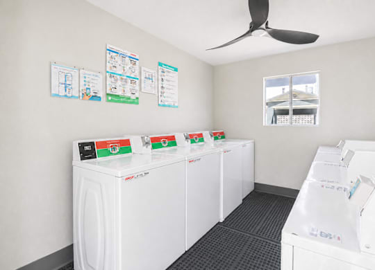 A row of washing machines in a laundromat.