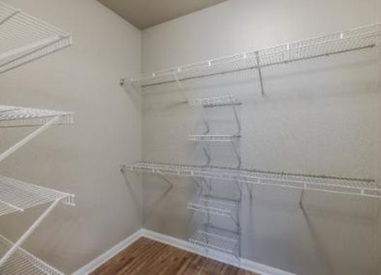 Empty white shelves in a room.