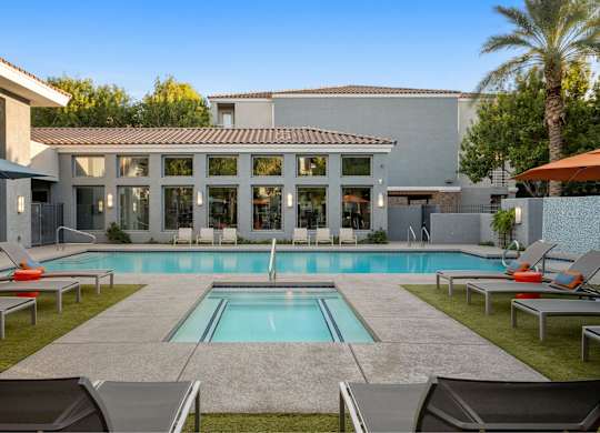 A modern house with a pool in the backyard.