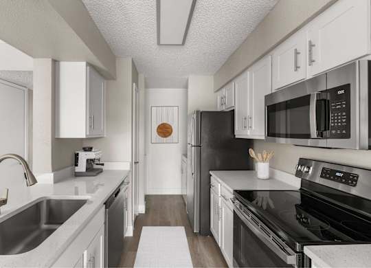 A modern kitchen with black appliances and white cabinets.