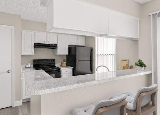 A kitchen with a refrigerator, oven, and stove.