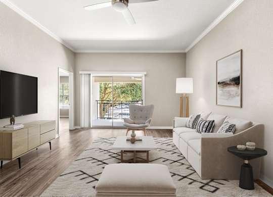 A modern living room with a flat screen TV, a white sofa, and a coffee table.