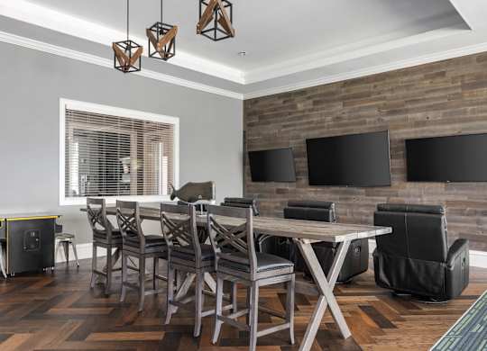 A modern dining room with a wooden table and chairs.