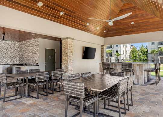A patio with a table and chairs.