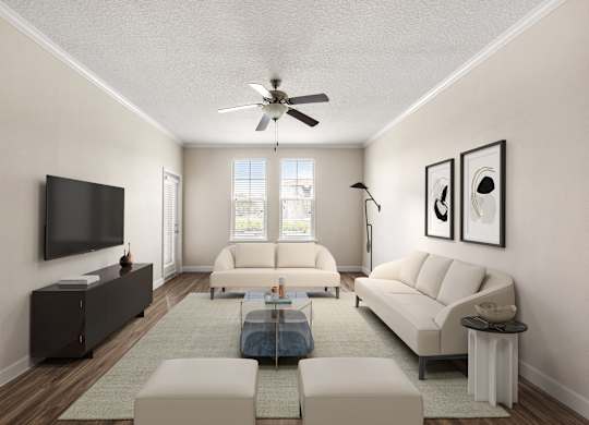 A living room with a white couch, a coffee table, and a flat screen TV.