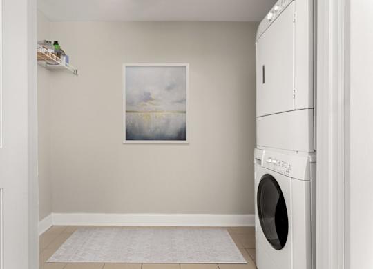 A laundry room with a washing machine and a painting on the wall.