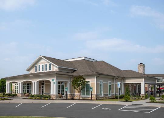 A building with a parking lot in front of it.