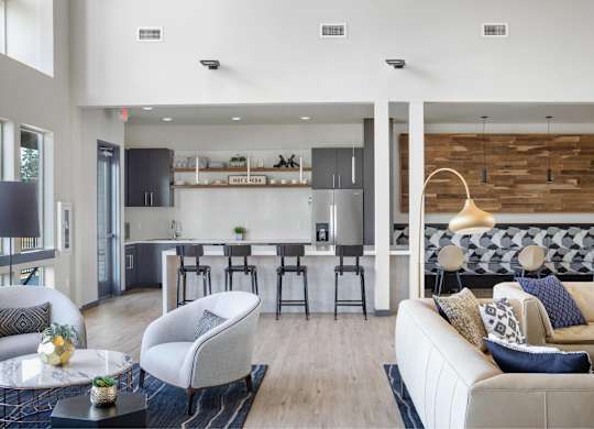 A modern living room with a bar area and a couch.
