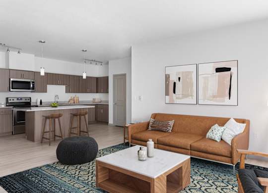 A modern living room with a brown couch and a coffee table.
