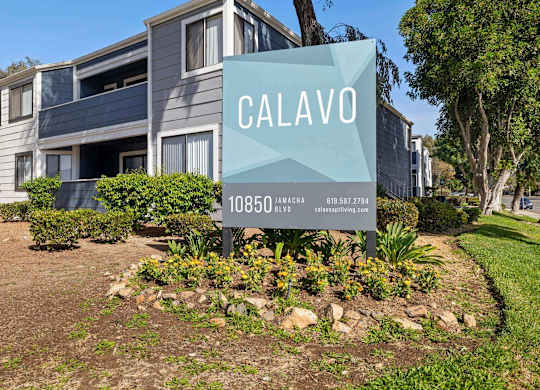 A sign for Calavo in front of a building.