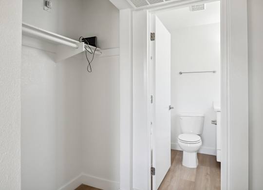 A white toilet in a small bathroom.