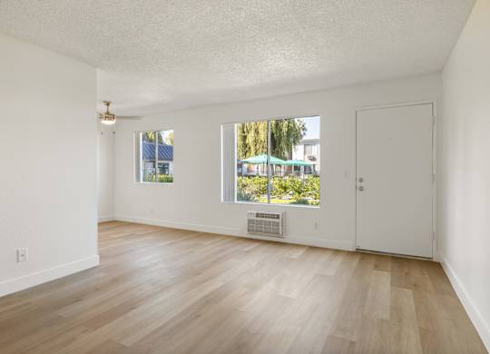 A room with a window and a door.