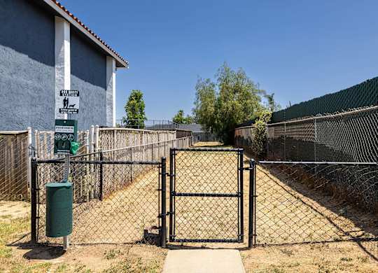 A gate blocks the entrance to a fenced area.