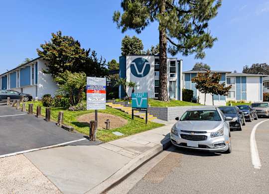 A parking lot with a sign that says